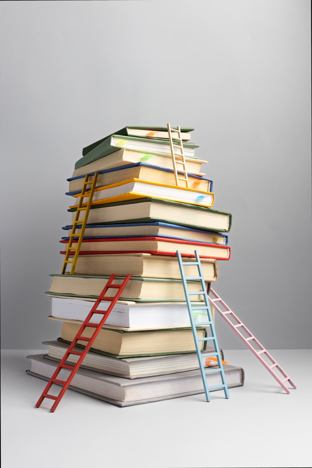 Young man working with books in library